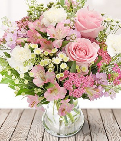 Perfect Pinks - Pretty and pink blooms make up our Perfect Pinks florist bouquet. This bouquet contains a mixture of pink roses and alstros, white carnations, and seasonal foliage.