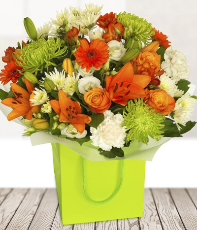 Lime & Orange - A dazzling vibrant arrangement suitable for all occasions. Stunning Orange roses and gerberas are perfectly accompanied by vibrant lilies and chrysanthemums.