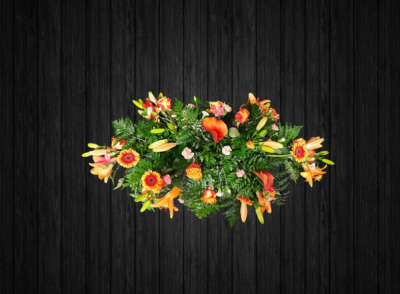 Tropical Rain - CSK57 - Beautifully arranged orange and peache coloured coffin spray includes roses, lilies, calla lilies, germini, spray carnations and foilage. Price: 3ft Standard - 4ft Deluxe - 5ft Luxury