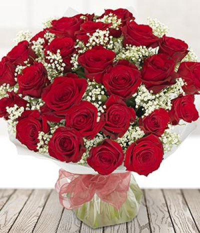 Perfection - 24 of the finest red roses, lovingly arranged and hand-delivered especially to your recipient. Gypsophila finishes off this bouquet perfectly and adds depth to these luscious red roses. Surprise your true love with a beautiful bouquet.