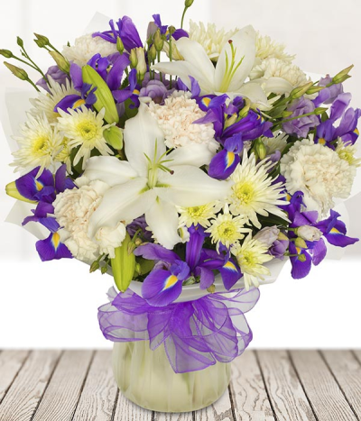 Devotion - Prepared using the finest seasonal white, violet flowers, this pure bouquet is hand-made.
