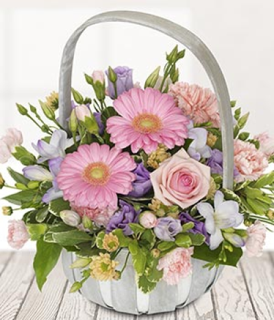 Delightful - Pretty and pink perfectly sums up this basket. With pink tones throughout this basket arrangement its is easy to see how happy the recipient will be when they receive it.