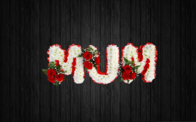 Lovely - MUM82 - Beautifully arranged MUM tribute in red and white colours using roses, carnations, gypsophilia, leather leaf on a white chrysanthemums base and ribbon edge. Price: Standard (without ribbon) - Deluxe (with ribbon). Stand frame included.