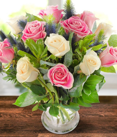 Taunton - Our Taunton bouquet is an elegant mix of vendela roses, complemented by blue eryngium with each stem sent in bud so your recipient can watch the flowers bloom in their home upon arrival.