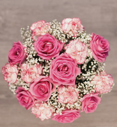 Mother's Blessings - Mother's Blessings contains a gorgeous mix of pink roses and white carnations with delicate pink tips, complemented by gypsophila million stars