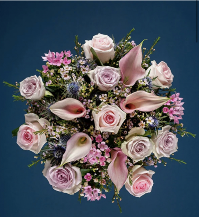 Cala Lily & Rose - The elegant pink Calla lilies and beautiful roses in this bouquet, alongside the eucalyptus foliage make it a sure winner with any lucky recipient.