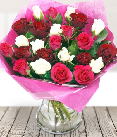Peace and Love - A delightful bouquet of mixed red, white and pink roses, a guaranteed joy, sure to let that special someone know how you feel. Our gorgeous roses are delivered in bud by our courier for maximum freshness to ensure they are enjoyed for as long as possible. 12 rose bouquet