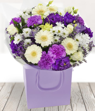Vintage - A sumptuous mix of purple and whites all ready to be displayed in a handy gift bag.