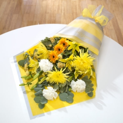 Sunshine - Send somebody a ray of sunshine! Yellow Chrysanthemums and Lilies mixed with golden spray Carnations and Germini. A bright and cheerful arrangement for any occasion.