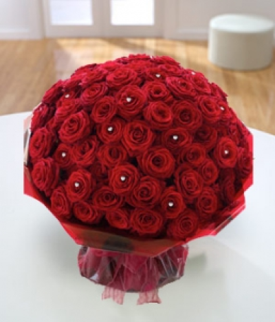 Ultimate - One hundred of the most exquisite, long-stemmed, large-headed red roses will be arranged by hand to create this stunningly intense, opulent display. Finished with a sprinkling of sparkling diamanté pins, this beautiful gift will remain in their heart forever. This item requires 1 days notice to order.