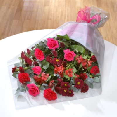 Rosy Love - Cerise pink Roses with burgundy Chrysanthemums and bright Alstroemeria for a hot and spicy bouquet.