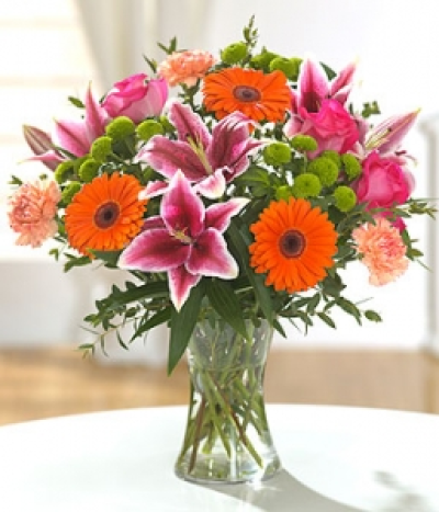 Carousel - Our expert florists will personally create your bouquet using the finest and freshest cerise, orange, purple and lime flowers. Hand-Tie in water.