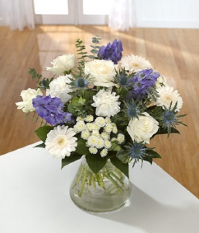 Purple Haze - Whites all the way with Roses, Carnations and Chrysanthemums. Aconitum and Eryngium add the accents of blue. Hand-Tie in water.