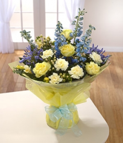 Marie Curie - Blue and yellow are the Marie Curie brand colours. This stunning hand-tied bouquet features yellow and blue for friendship.