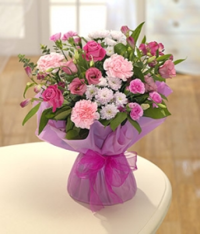 Strawberry Crush - Soft and rich pink flowers featuring Roses, Carnations and Lisianthus beautifully presented for that special delivery.
