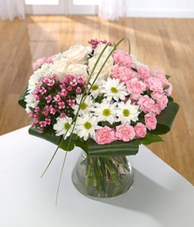 Grace - A classic Biedermeier hand-tied of folded Aspidistra leaves which frame groups of pink Roses, Carnations and Chrysanthemums in this delicate hand-tied.  Hand-tie in water.