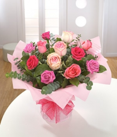 Shades of Pink - Simple yet beautiful - a mixed palette of pink Roses presented as an aqua pack hand-tied.
