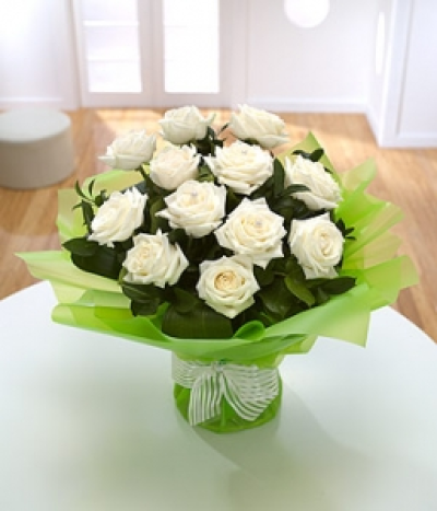 Pearl - One to treasure, a true celebration of beauty: twelve pearl-pinned white Roses.