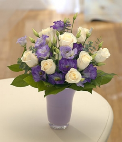 Moonshine - An ideal gift of cream Roses and purple and mauve Lisianthus delivered in a vase.