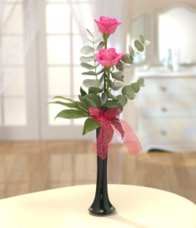 Simple Elegance - Stunning pink Roses are simply presented in a stylish black vase.  Send the ultimate romantic gift.