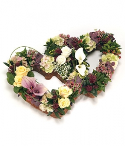 Double Open Heart - A stunning double heart shaped tribute in subtle colour scheme of pink, peach, bronze and lemon, including Lilies, Hydrangea, Roses and flowering foliage. Size: Height - 38cm (15") Width - 58cm (23").