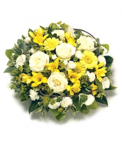 Posy Arrangement - A foliage edged posy arrangement including Roses, fragranced Freesias, Carnations and complementary foliage. Size: Height - 31cm (12").