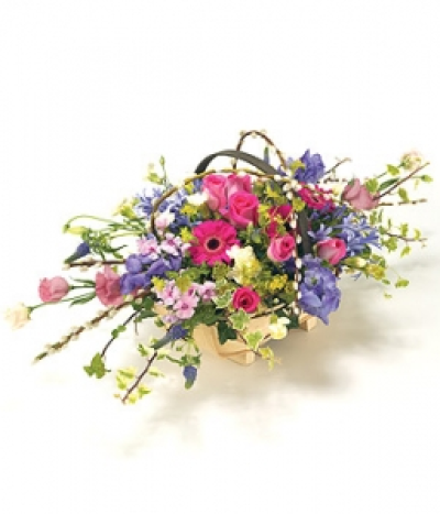 Country Style Basket - A country style Trug basket arrangement with a mix of flowers in delicate shades of pink, purple & blue, including Roses, Aconitum, Veronica and Phlox. Size: Height - 28cm (11") Length - 40cm (16"). Available in any colours.
