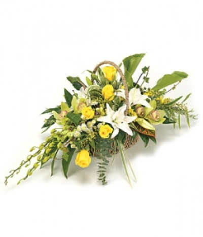 Basket Arrangement - A stunning Sea grass Basket arrangement, including exotic Orchids, Lilies, Roses and Chrysanthemums with complementary foliage. Size: Height - 31cm (12") Length - 41cm (16"). Available in any colours.