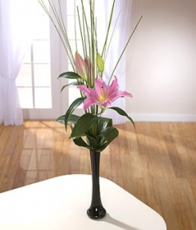 Simplicity Vase - Not even Bear Grass and Aspidistra leaves can steal the limelight from this single stem of pink Lilies.
