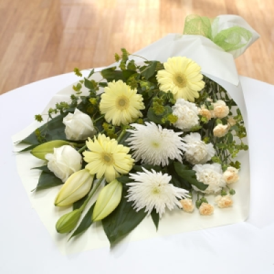 Snowy - Cream Rose, White Lily, Cream Gerbera, White Bloom Chrysanthemum, White Carnation, Cream Spray Carnation, Aspidistra Leaf, Bupleurum.