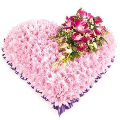 Solid Heart - A pretty and feminine massed heart with a spray of Orchids.