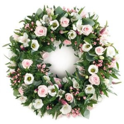 Pink and White Wreath - A pretty delicate and feminine wreath with subtle pink and white tones, including a foliage edge and containing light pink roses, bouvardia, white eustoma and alstromeria. 