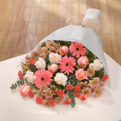 Peaches - Peach Gerbera stand out in this bouquet closely followed by Roses and all backed up by Carnations and muted Chrysanthemums.