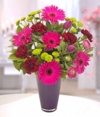 Desire - A beautiful bouquet of rich flowers featuring cerise Gerbera, Carnations, Ranunculus, Tulips and Chrysanthemums. The perfect gift for someone who likes to arrange flowers.