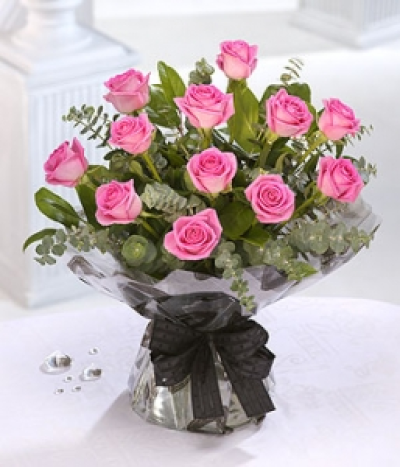 Love - What could be more romantic than perfect pink Roses for a romantic day? This vase arrangement will warm her heart.