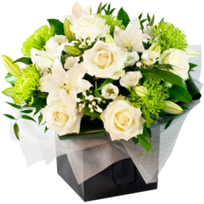 Blanche Elegante - Blanche Elegante is a classic collection of oriental lilies and long-stemmed white roses, arranged amidst subtle lisianthus and bouvardia flowers Striking shamrock blooms add contrast while ruscus foliage adds texture, before the whole ensemble is framed to perfection with a luxury wrap, finished with a stylish black presentation bag. Price: Standard £50. 00 Luxury £75. 00 Superior £100. 00+