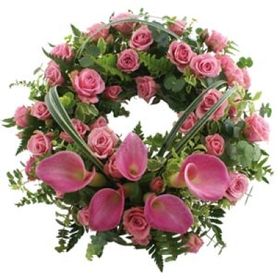 Luxury Wreath - Beautiful calla lilies, delicate spray roses and a mass of lush, vibrant greenery make up this stunning designer wreath arrangement. Carefully crafted and finished with loops of grass, this wreath arrangement is available in white or pink. Small 14" £70.00 Medium 18" £100.00 Large 21" £130.00