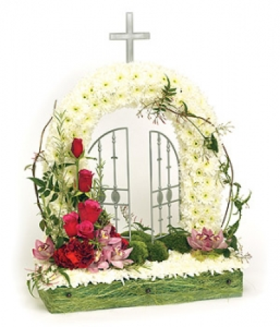 Gates Of Heaven - White Chrysanthemum based 'Gates of Heaven' design with pink spray, including Roses, exotic Orchids, Carnations and complementary foliage. Size: Height - 51cm (20") Width - 46cm (18"). Available in any colours and styles.