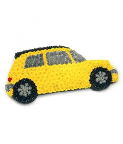Modern Motor Car - Based Chrysanthemum wreath in the shape of a motor car. Size: Height - 36cm (14") Width - 78cm (30"). Available in any colours and styles