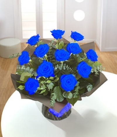 Blue Moon - Less is more - a dozen blue Roses with Eucalyptus. 12 roses Standard size. 24 roses Medium size. 50 roses Large size.