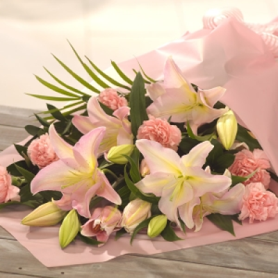 Candy - A bouquet of soft, summer favourites, pale pink Lilies and Carnations are beautifully presented and gift wrapped. Designed for someone who loves to arrange flowers.
