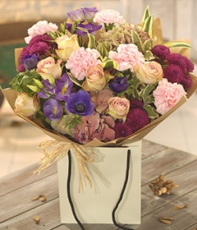 Dusk - Vintage in style, this delightful aqua packed floral gift bag is simply packed with Roses, Hydrangea, Lisianthus, Chrysanthemums and Carnations.