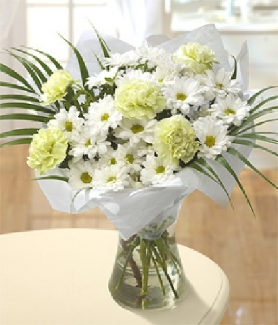 Pure Spirit - Pure white Xanthus and beautiful light green Carnation blooms, complimented with dramatic Phoenix Palm leaves.