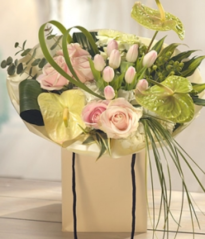 The Greatest Love - An incredible aqua pack flower gift bag packed with white Hydrangea, cream Anthurium Lilies, pink Roses and Tulips, set against a luscious green leaf backdrop. A truly impressive and fabulously fragrant gift.