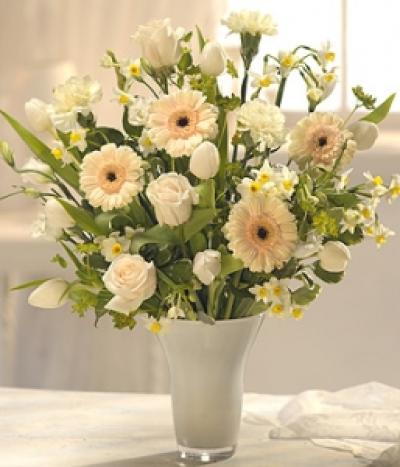 Pure Heart - Make this one to remember with this beautifully delicate, creamy white flower bouquet. Pure white Tulips, Lisianthus and Narcissi, married with peach Roses and Germini - an exquisite combination.