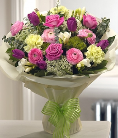 Spring Style - Delicately fragrant and stunning in design, this aqua pack bouquet is a spring fresh, sophisticated arrangement featuring Roses, Tulips, Carnations, Freesias and Ranunculas.