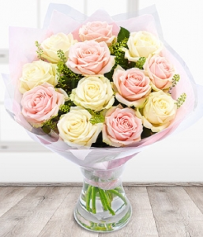 Lavish - A lavish bouquet of 12 premium Dutch Avalanche Roses with a flourish of Green Bell.