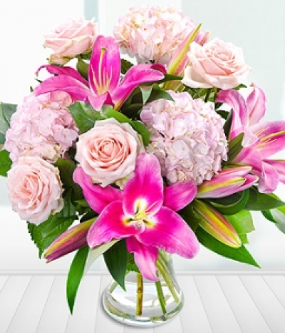 Reflection - A luxurious bouquet of dyed pink Hydrangeas and premium Dutch Lilies and Roses.