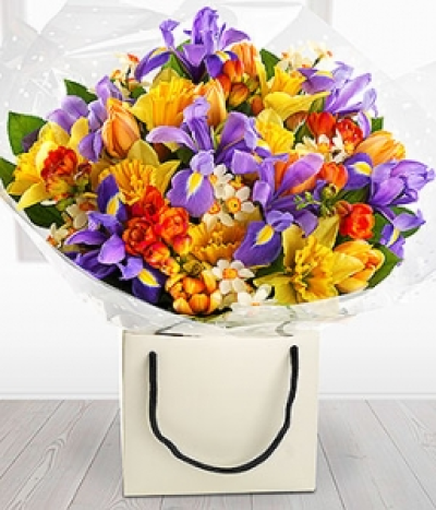 Just Divine - Go for WOW with this incredible spring flower Arrangement. Daffodils, Narcissi, Tulips, Iris and beautifully fragrant Freesia. Available during Spring
