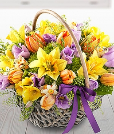 Spring Time Basket - A wonderfully bright and delicately fragrant spring flower Basket featuring Daffodils, Freesia, Tulips, Lisianthus, Narcissi and Sweet William.